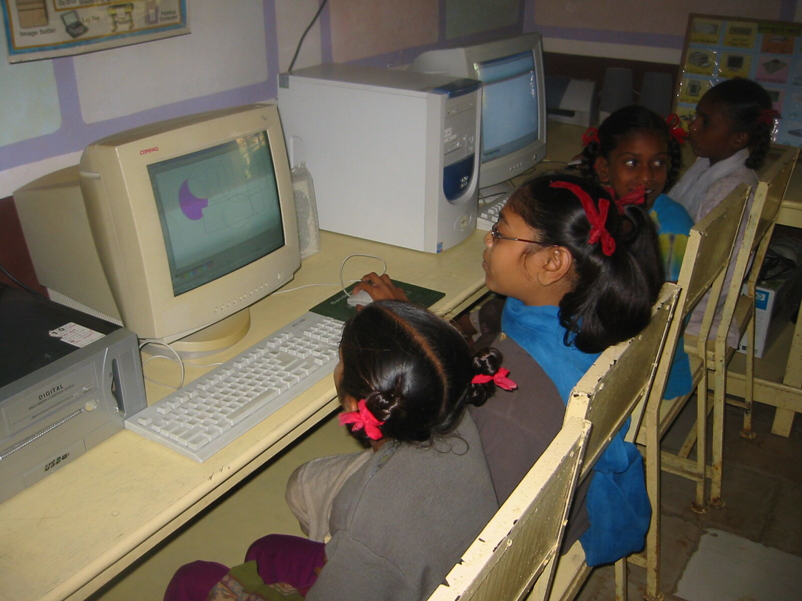 Girls getting computer class near Baroda, Gujarat, India. January 2007. The computers are provided by http://www.blossomedu.org