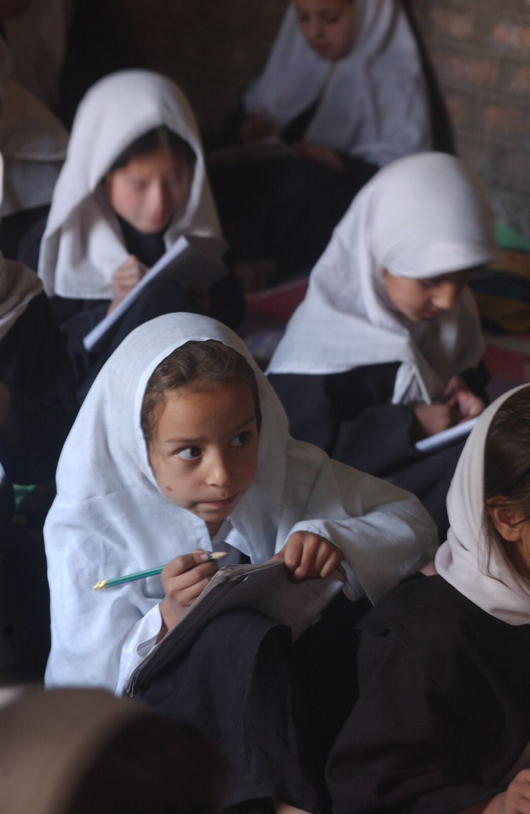 Original caption states, "Afghanistan: Girl's Classroom Scene -- USAID has povided extensive educational programs to improve the education level for young girls and women."