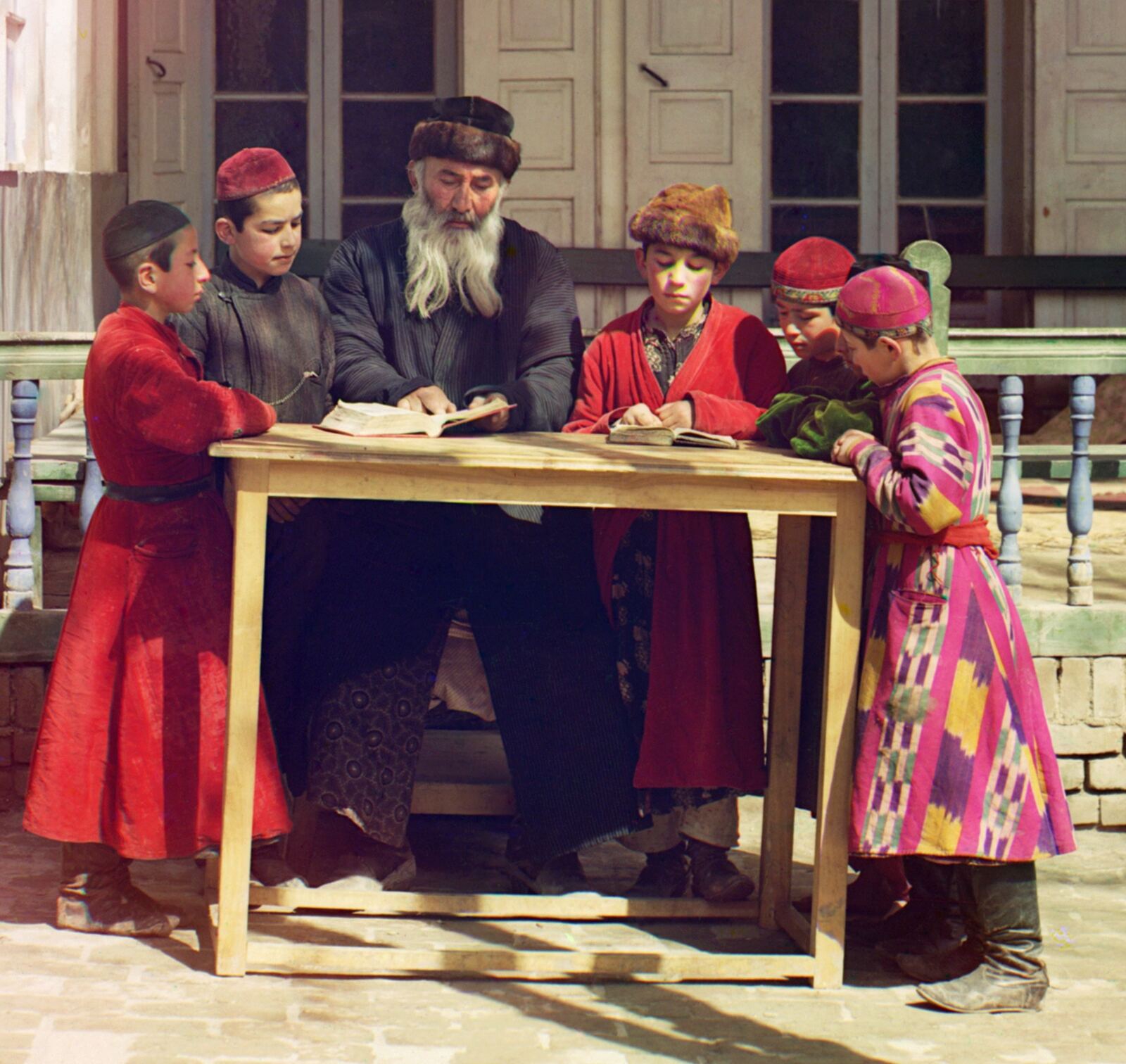 Jewish Children with their Teacher in Samarkand . Early color photograph from Russia, created by Sergei Mikhailovich Prokudin-Gorskii as part of his work to document the Russian Empire from 1909 to 1915.